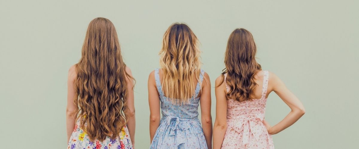 Picture of 3 women turned away from the camera with blank background