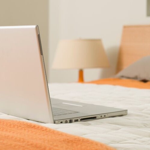 Image of laptop on bed