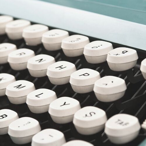 Image of a blue typewriter |Sarah Richards Social