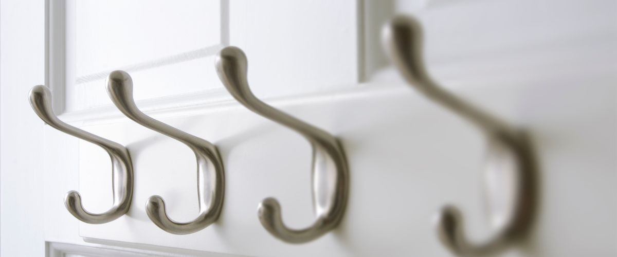 Image of a line of coat hooks as a simile for marketing hooks