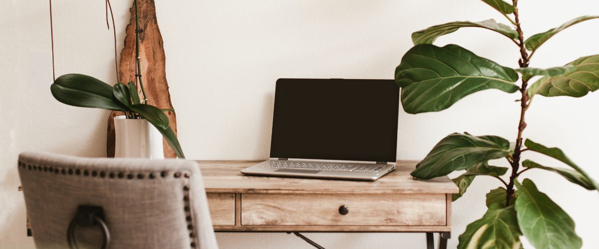Image of a rustic looking desk with a laptop